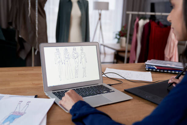 istock Midsection Of Businesswoman Using Laptop At Office 1402906048