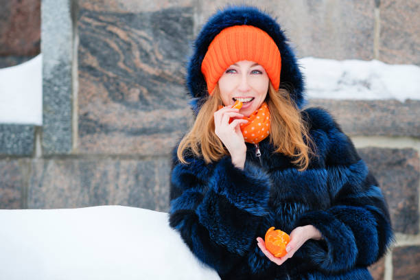 istock Young Woman Enjoy Tangerine 1402906139