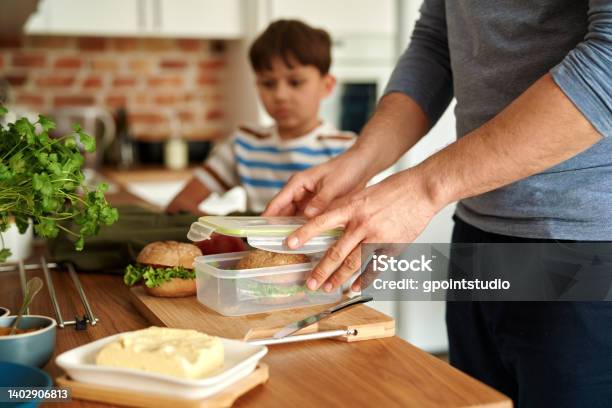 Midsection Of Man Preparing Food On Table Stock Photo - Download Image Now - Lunch Box, Child, Childhood