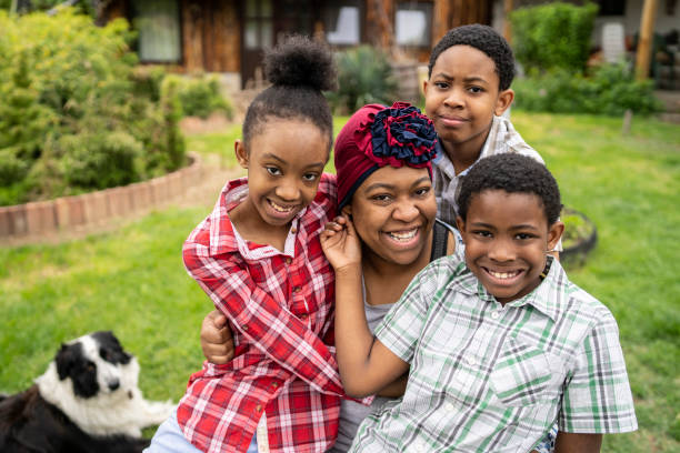 istock Happy small family hugging in the backyard 1402906855