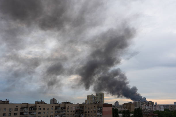 istock Thick smoke in the clouds, fire in city. 1402907161