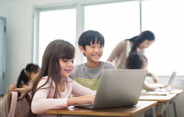 istock Diverse Multi ethnic of Little girl and boy using laptops 1402912724