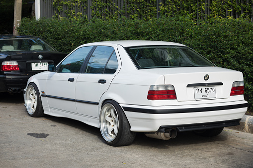 Back of white colored  M3 sports cars parked in street in Bangkok