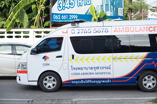 Driving thai ambulance on emergency duty in street in Bangkok Chatuchak
