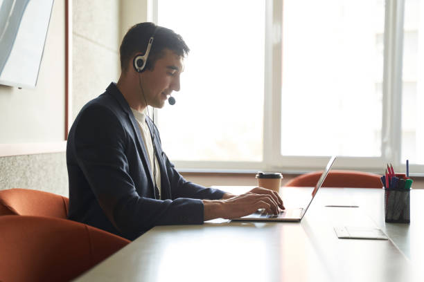 istock Clerk in office working remotely through laptop 1402915132