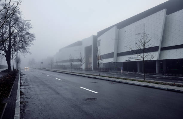 asphalt road in the fog in the city. - damp course imagens e fotografias de stock