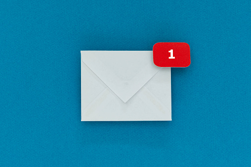 White envelope with notification sign with the number 1 on blue background