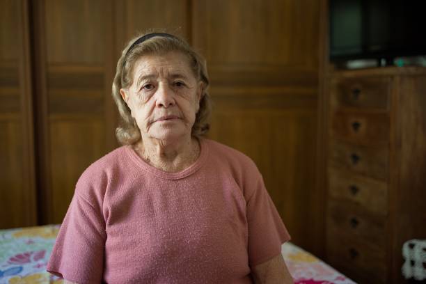 istock Old lady by herself, at home 1402915759