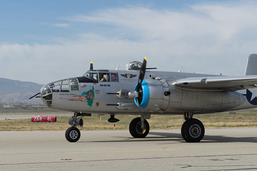 Chino Airport, California, USA - May 15, 2022: image of B-25J Mitchell 'Maid in the Shade' with registration N125AZ shown taxiing at the Chino Airport in preparation for take off. Maid in the Shade is one of a handful of airworthy B-25s left.