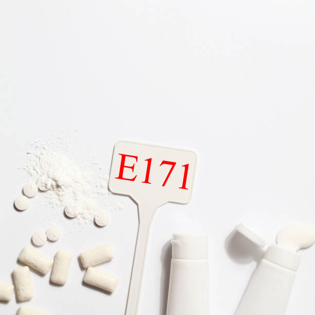 istock Titanium dioxide, E171, dangerous additive concept. gum, pills, toothpaste, powder and sign with E171 on white background. copy space square 1402916561