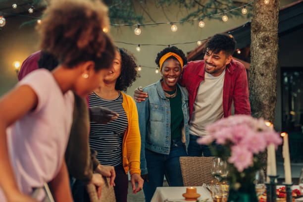istock Affectionate family enjoying dinner during their get together in the backyard 1402916812