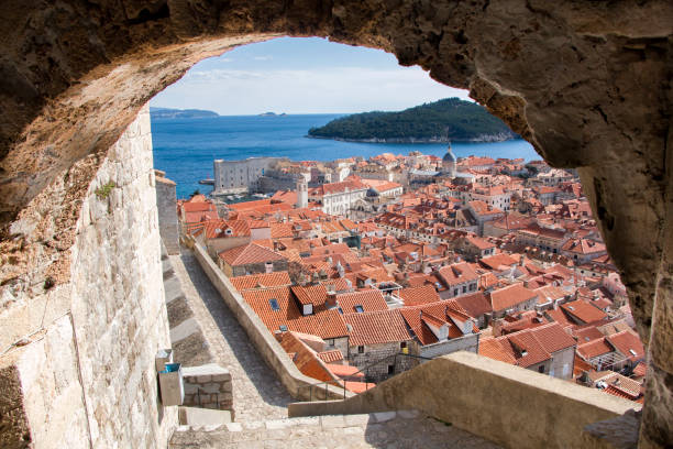 Panorama of Dubrovnik, the old city of the Mediterranean Roofs of the old town of Dubrovnik dubrovnik walls stock pictures, royalty-free photos & images