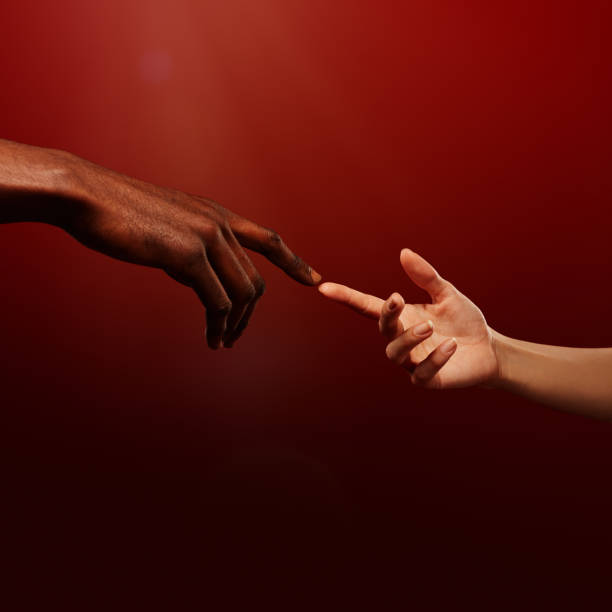 istock Two hands reaching for each other. Human relations, unity, togetherness, symbolism concept 1402922193
