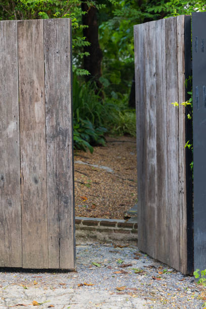 istock Open wooden gate into a garden in Bangkok 1402923261
