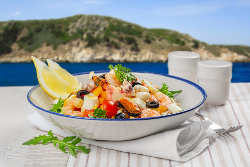 Dinner Table with mediteranina sea food near the sea shore.