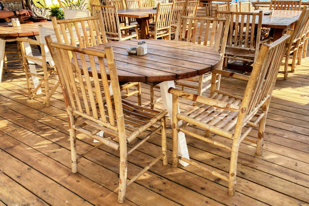 istock Empty wooden table and chairs in the beach cafe 1402925428