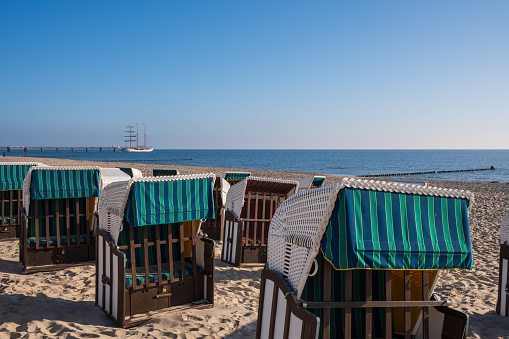 Strandkorb beach-chairs for hire on a beach at the baltic sea in Bansin, Usedom, Germany