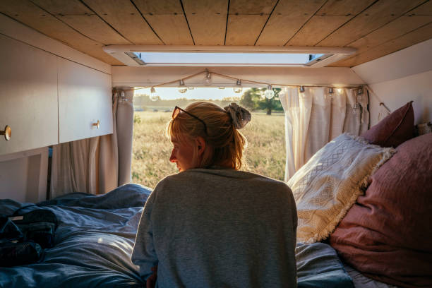 istock Woman relaxing in a luxurious camper van 1402926083