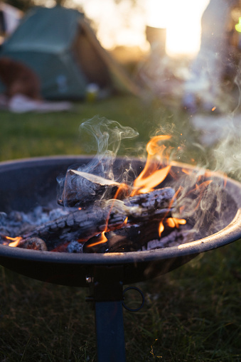 Fire pit with a bonfire at a campsite