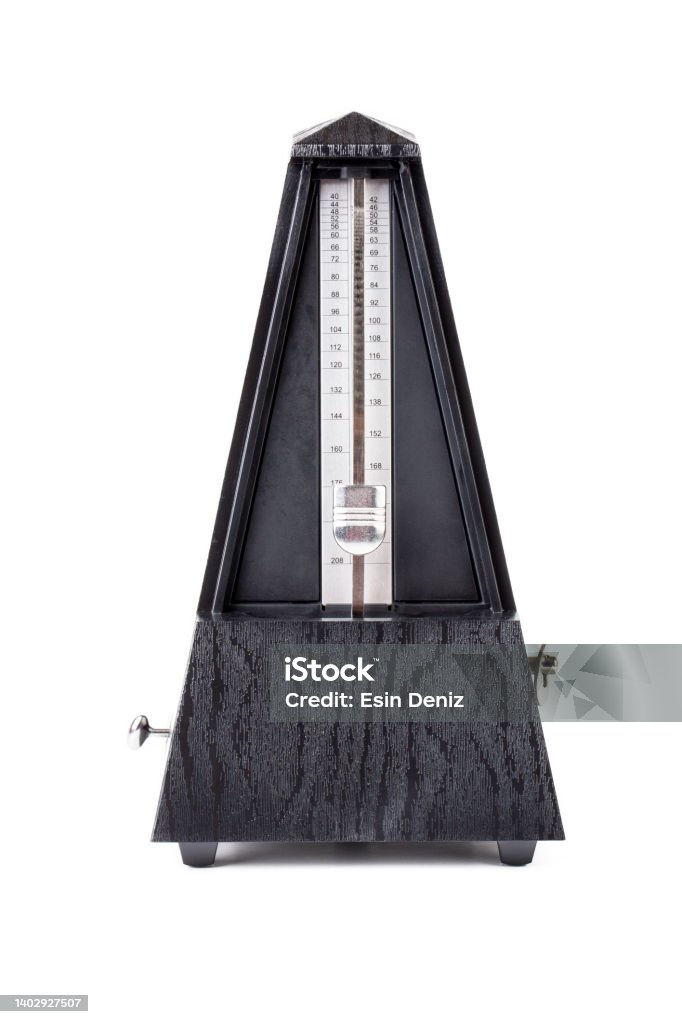 Metronome in action isolated and on a plain background Clock Stock Photo