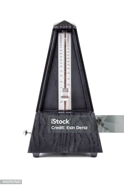 Metronome In Action Isolated And On A Plain Background Stock Photo - Download Image Now