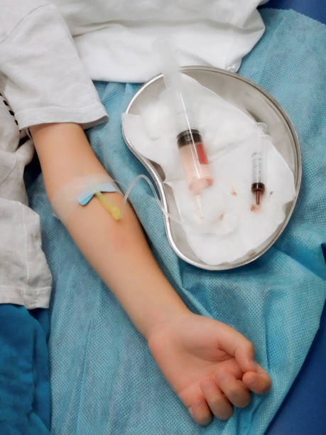 istock Taking blood from a vein in a child's arm. Taking a blood test. 1402929793