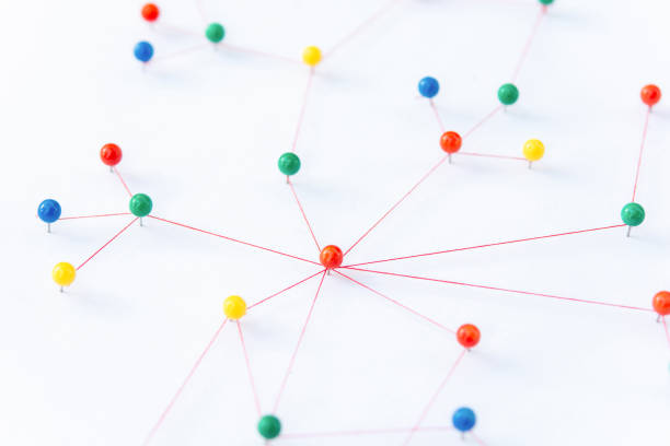 istock Linking entities, Blockchain, social media, Communications Network, The connection between the two networks. Network simulation on paper linked together by yarn 1402930675