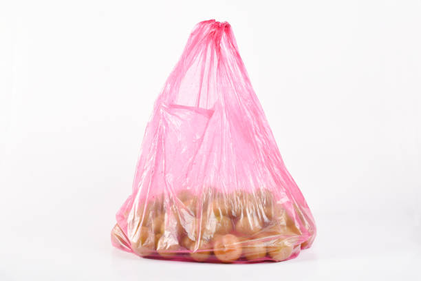 istock Plums in the plastic bag isolated on the white background 1402932634