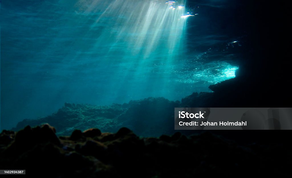 Lights underwater Underwater photo of beautiful rays of light over the reef. From a scuba dive Sea Stock Photo