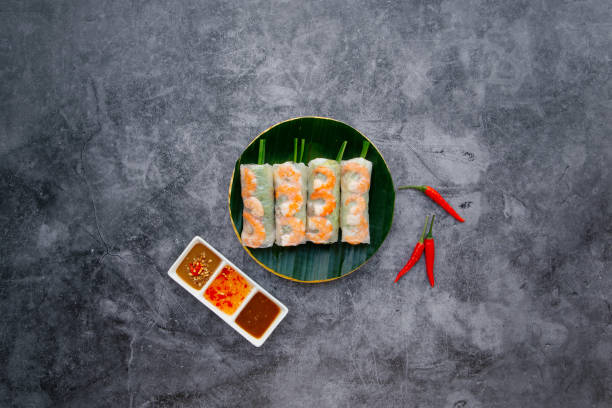 istock Fresh shrimp, prawn Spring Roll served in bowl isolated on dark grey background top view of japanese food 1402934895