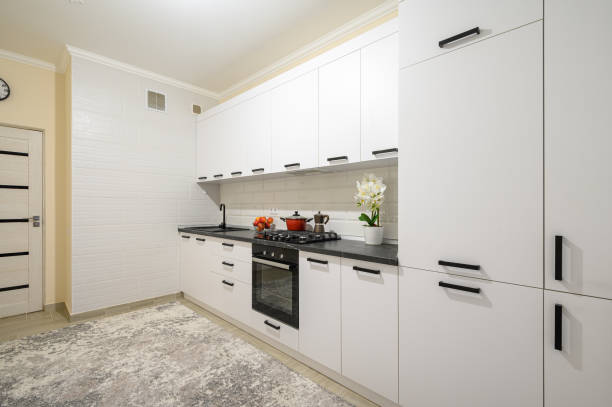 istock Trendy white modern kitchen interior with minimalistic furniture 1402939696