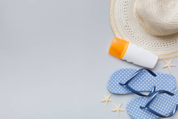 istock Summer vacation concept flat lay. straw hat beach accessories and towel top view. Space for text. travel concept 1402941058