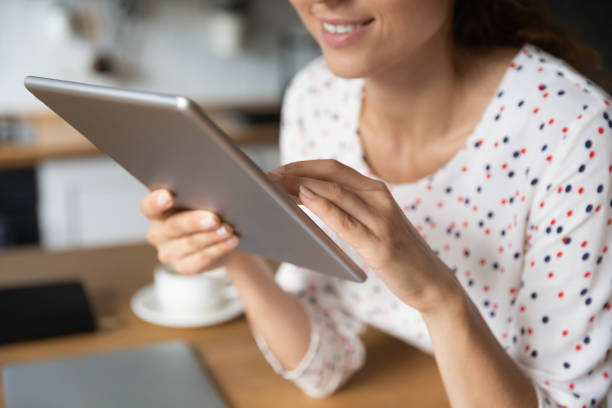 Happy female freelancer, shopper, digital gadget user working from home