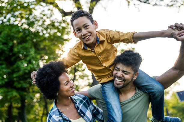 istock Young loving family having fun in the park 1402944917
