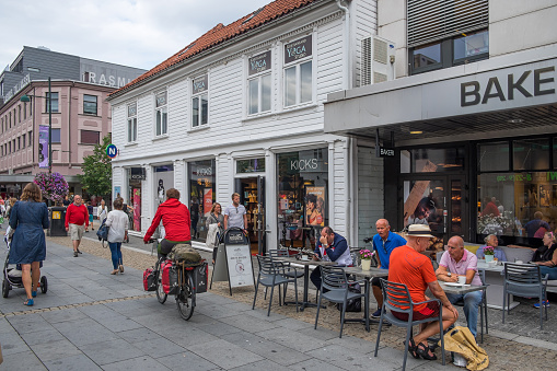 Kristiansand, Agder, Norway - August 08, 2018: People and terraces in the commercial street of Markens Gate in the urban center of the city