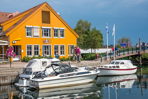 Kristiansand, Agder, Norway - August 08, 2018: Pleasure boats docked at the city's Fish Market harbor
