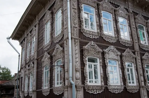 Beautiful wooden house in Tomsk. Ornate windows. Russian Federation
