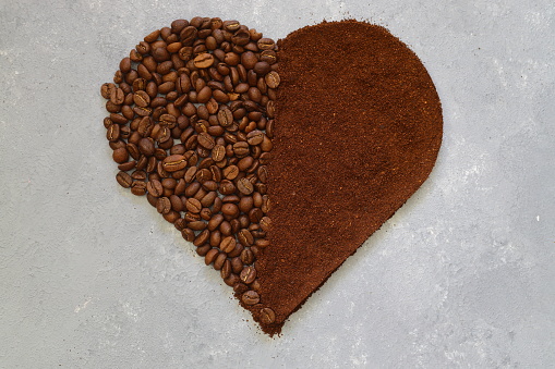 Heart made out of coffee beans on a white background