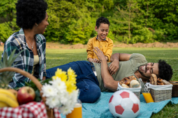 istock Happy family spending a spring day on picnic 1402949207
