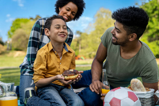 istock Happy family spending a spring day on picnic 1402949248