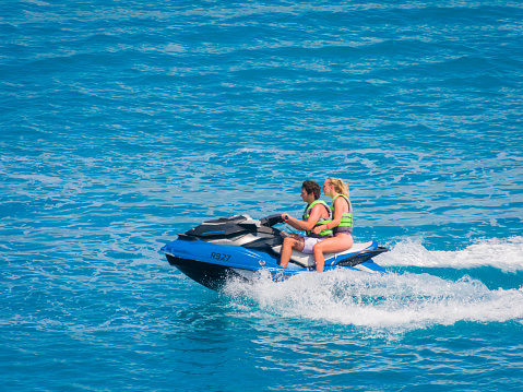 Aerial view of jet skier in blue sea. Jet ski in turquoise clear water racing stock photo