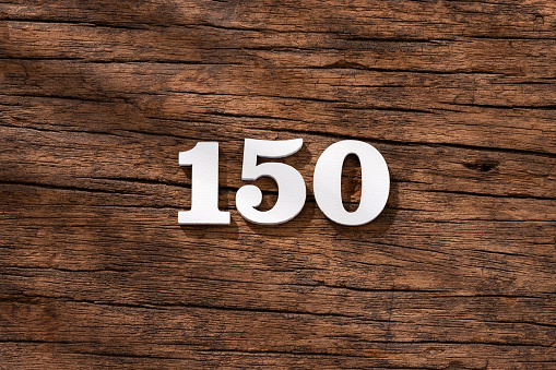 Number 150 in wood, isolated on rustic background