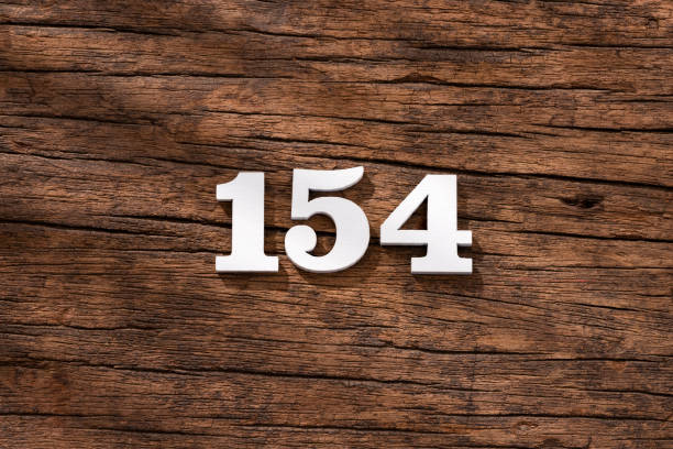 istock Number 154 - piece on rustic wood background 1402953012