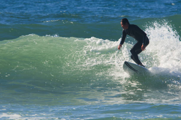 istock Surfer Riding a Wave in Southern California 1402953975