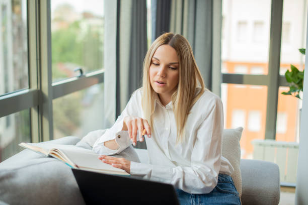 istock Young beautiful woman working from home 1402955237