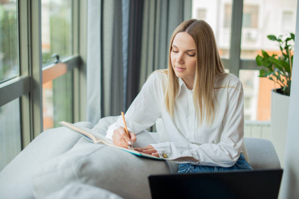 istock Young woman working from home 1402955256