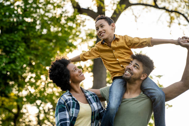 istock Young loving family having fun in the park 1402955313