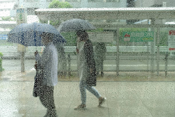 istock Rainy city beyond the screen of raindrops 1402956057