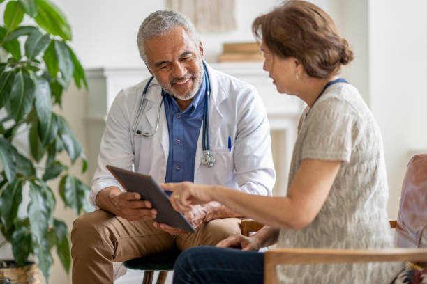 istock Homecare Visit with a Patient 1402962395