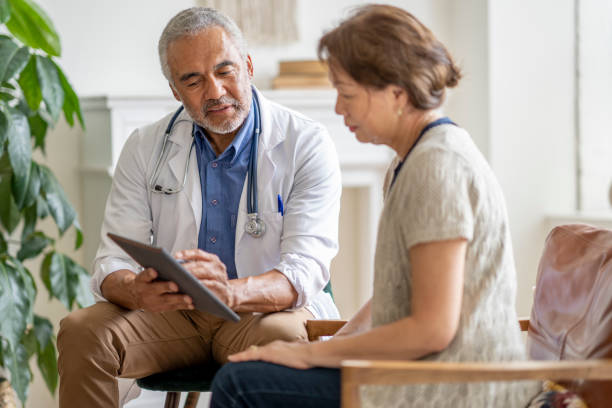 istock Homecare Visit with a Patient 1402962421